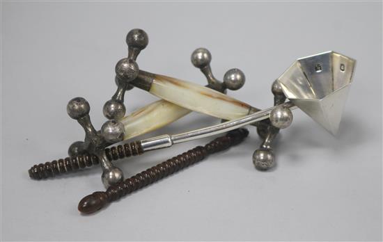 A pair of 1920s silver and mother of pearl mounted knife rests and a modern silver candle snuffer (handle a.f.).